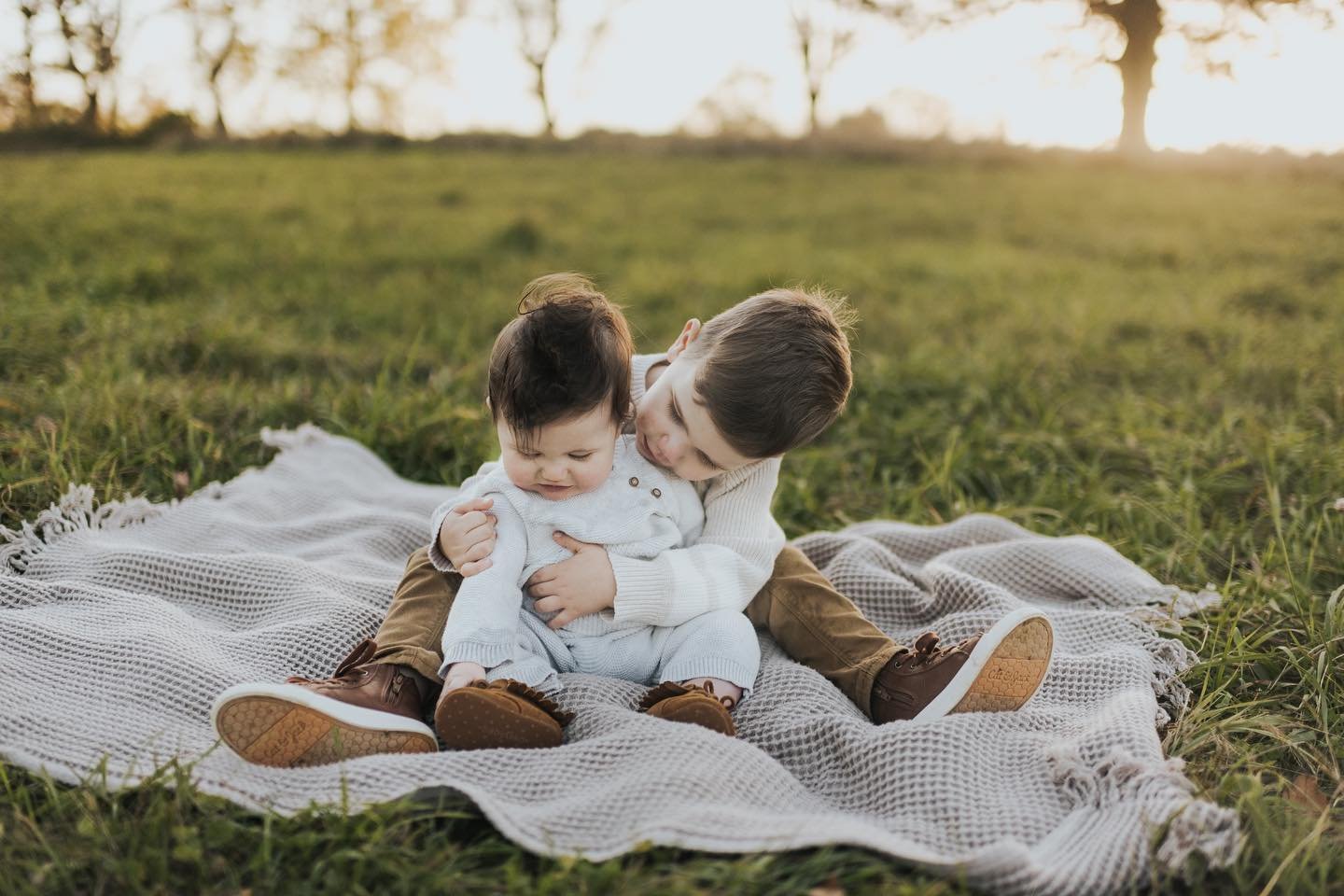 Older Sibling Holding Younger Sibling