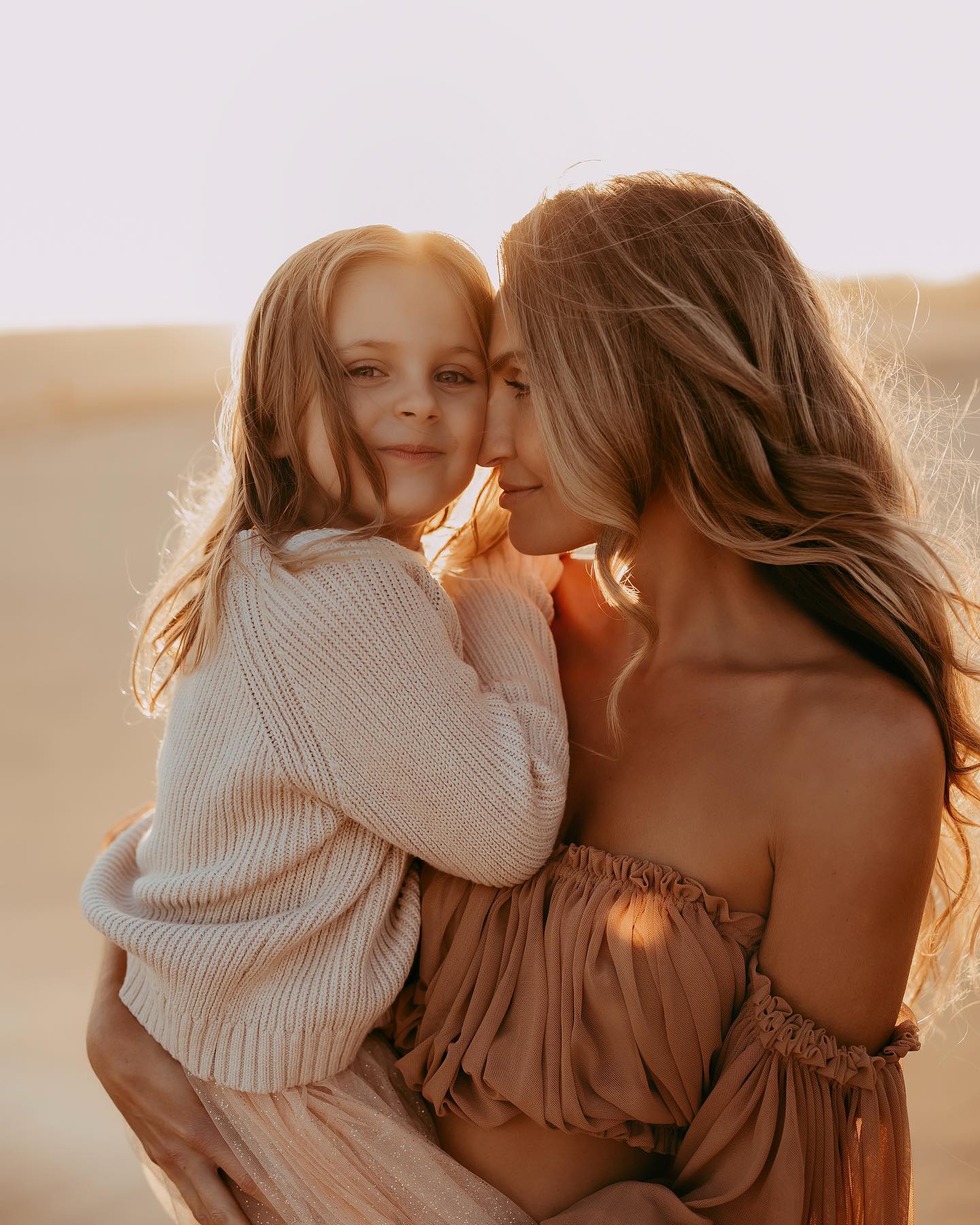 Golden Hour Mother-Daughter Embrace