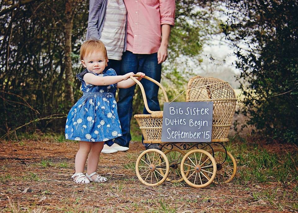 Big Sib Pulling a Wagon with Baby Items