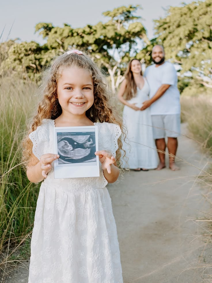 First Child Holding Ultrasound Photo