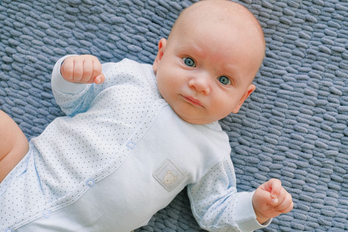 Baby lying on soft blanket, close up portrait